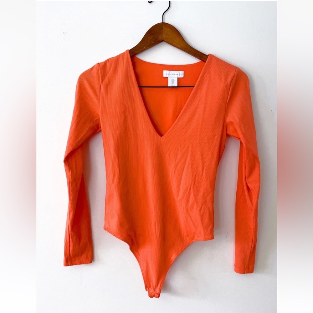 House of Harlow 1960 Coral V-Neck Bodysuit with thong snap has great stretch